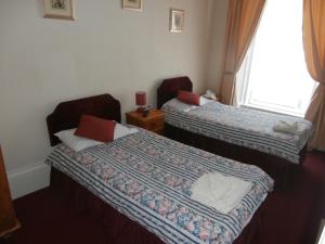 Postel nebo postele na pokoji v ubytování Monorene Guest House
