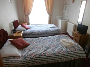 Postel nebo postele na pokoji v ubytování Monorene Guest House