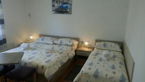 Posteľ alebo postele v izbe v ubytovaní Apartments Joško