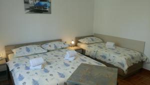 Posteľ alebo postele v izbe v ubytovaní Apartments Joško