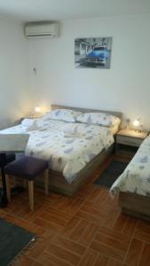 Posteľ alebo postele v izbe v ubytovaní Apartments Joško
