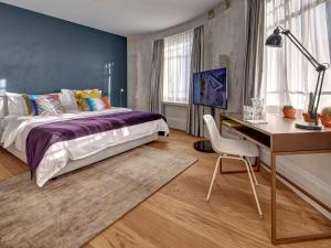 Postel nebo postele na pokoji v ubytování Hotel Anker Luzern