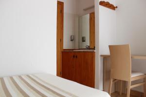 Postel nebo postele na pokoji v ubytování Hostal Masin