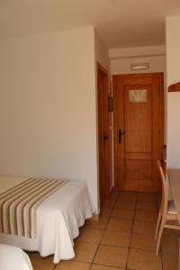 Postel nebo postele na pokoji v ubytování Hostal Masin