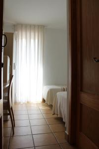 Postel nebo postele na pokoji v ubytování Hostal Masin