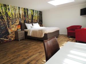 Postel nebo postele na pokoji v ubytování Hotel-Restaurant de Boer'nkinkel