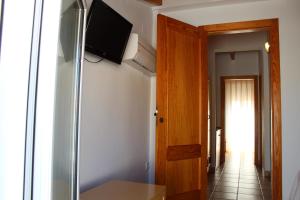 TV a/nebo společenská místnost v ubytování Hostal Masin + 14 fotografií
