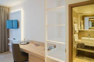 TV a/nebo společenská místnost v ubytování Garni Hotel Kessler
