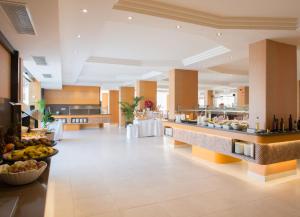 a lobby of a hotel with a buffet line at HL Suitehotel Playa del Inglés - Adults Only in Playa del Ingles