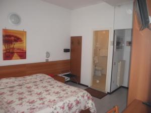 Łóżko lub łóżka w pokoju w obiekcie Hotel Touring