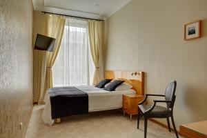 Llit o llits en una habitació de Anichkov Pension