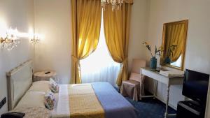 Ένα ή περισσότερα κρεβάτια σε δωμάτιο στο Hotel Ponte Sassi