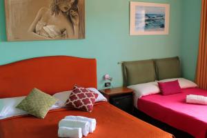 Postel nebo postele na pokoji v ubytování Colosseoinn