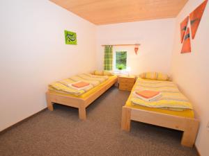 Ένα ή περισσότερα κρεβάτια σε δωμάτιο στο Ferienhaus Anna 1