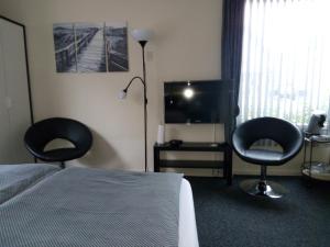 TV a/nebo společenská místnost v ubytování Bed & Breakfast Zuidlaren
