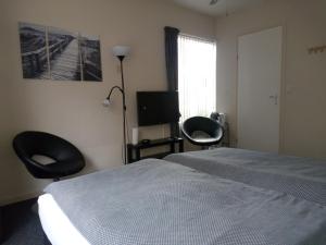 Postel nebo postele na pokoji v ubytování Bed & Breakfast Zuidlaren