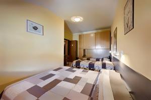Postel nebo postele na pokoji v ubytování Albergo Mancuso del Voison