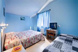 Postel nebo postele na pokoji v ubytování Albergo Mancuso del Voison