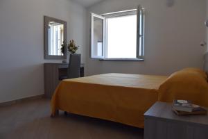 A bed or beds in a room at Appartamenti Torre