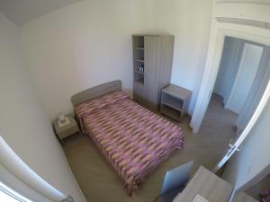 A bed or beds in a room at Appartamenti Torre