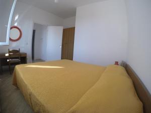 A bed or beds in a room at Appartamenti Torre