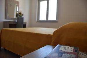 A bed or beds in a room at Appartamenti Torre