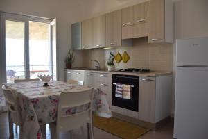 A kitchen or kitchenette at Appartamenti Torre