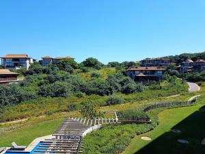 an aerial view of a golf course with houses at Zimbali Suites 301 in Ballito