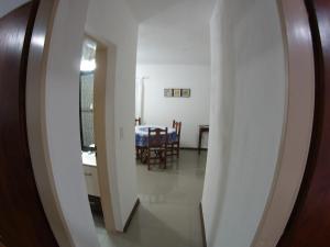 a hallway leading to a dining room with a table at Alojamiento Cuchi Corral in San Luis