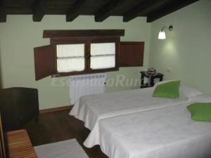 Ein Bett oder Betten in einem Zimmer der Unterkunft Casa Carballeira