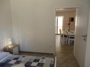 Postel nebo postele na pokoji v ubytování Apartments Karaba