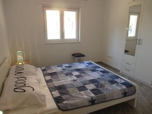 Postel nebo postele na pokoji v ubytování Apartments Karaba