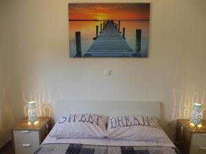 Postel nebo postele na pokoji v ubytování Apartments Karaba