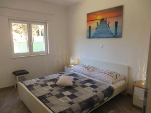 Postel nebo postele na pokoji v ubytování Apartments Karaba