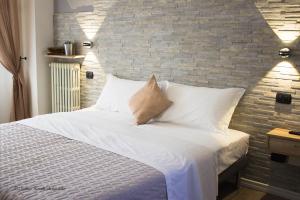 Postel nebo postele na pokoji v ubytování Aurelia Rooms