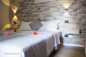 Postel nebo postele na pokoji v ubytování Aurelia Rooms