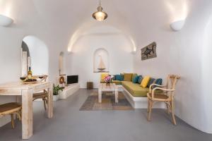 a living room with a couch and a table at Calliope's Villa with jacuzzi in Pyrgos