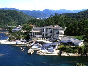 an aerial view of a resort on the water at Hotel Kinparo in Toyooka