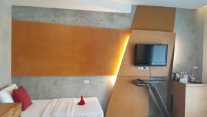 Postel nebo postele na pokoji v ubytování The Now Hotel - SHA Extra Plus