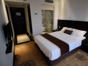 Postel nebo postele na pokoji v ubytování InnB Park Hotel