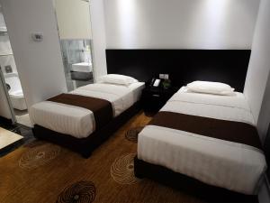 Postel nebo postele na pokoji v ubytování InnB Park Hotel