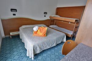 Postel nebo postele na pokoji v ubytování Hotel Rondinella