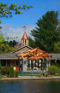 a house with a cross on top of it at Village Inn - Blowing Rock in Blowing Rock