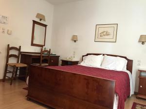 Ein Bett oder Betten in einem Zimmer der Unterkunft Hotel Pelops