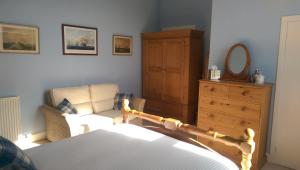 Postel nebo postele na pokoji v ubytování Lochinver Guesthouse