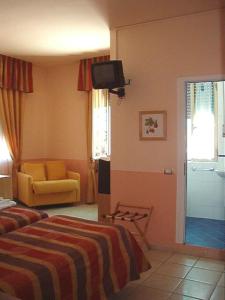 Postel nebo postele na pokoji v ubytování Hotel Morgana