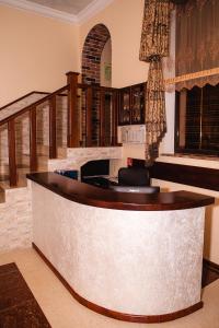 a bar in a room with a staircase at Guest House BoNaMi in Anapa