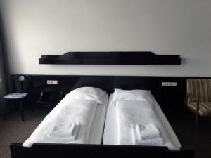 Voodi või voodid majutusasutuse Saigon Hotel toas