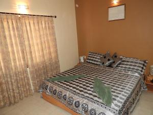 Ένα ή περισσότερα κρεβάτια σε δωμάτιο στο FF-1 Apartment