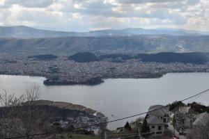 a view of a city and a body of water at Agnantio in Ioannina